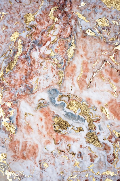 Free photo pinkish and gold marble textured