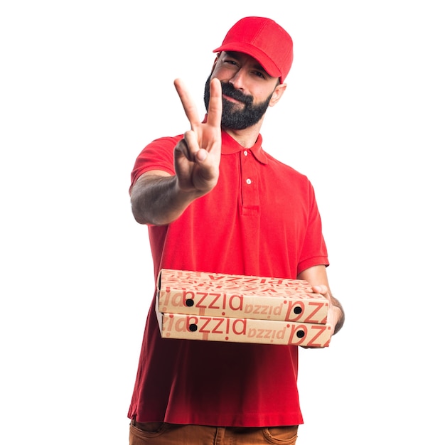 Free photo pizza delivery man  doing victory gesture