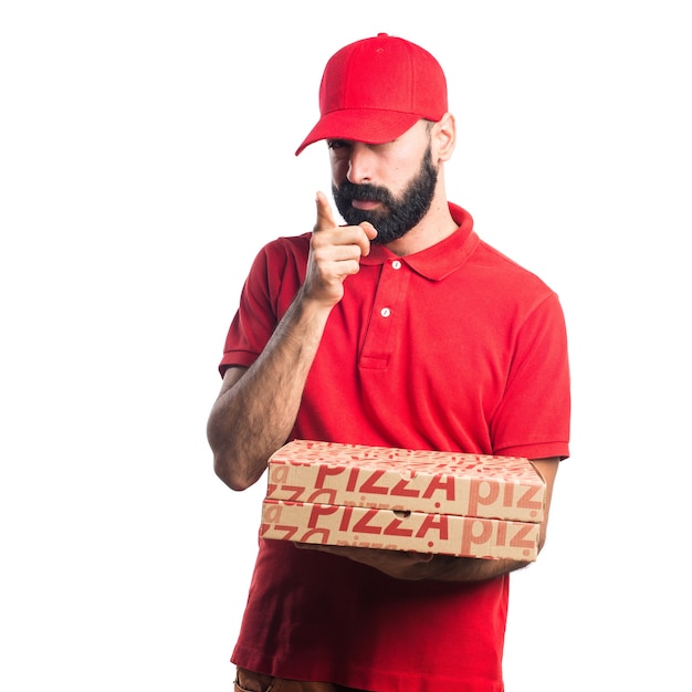 Free photo pizza delivery man pointing to the front