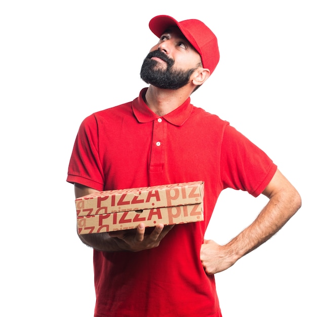 Free photo pizza delivery man thinking