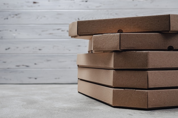 Pizza packs on light concrete background