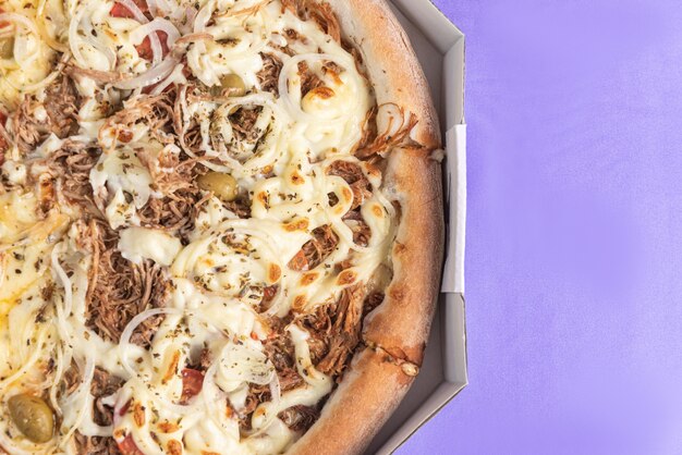 Pizza on the table in purple color