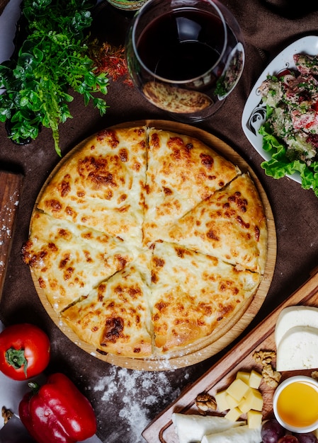 Free Photo pizza with cheese tomato and bell pepper on the table