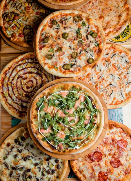 Pizzas set on the table, top view