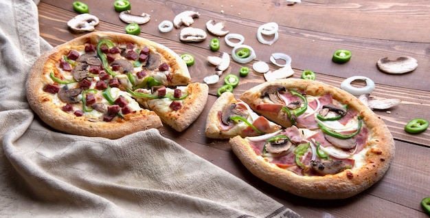 Free photo pizzas with mixed ingredients