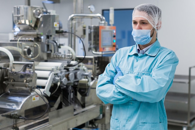 Free Photo plant picture factory worker is standing near machine steel machines manufacture