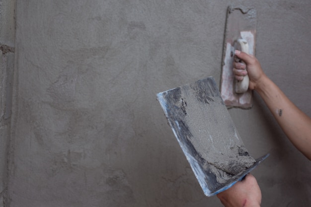 Free photo plasterer renovating indoor walls.