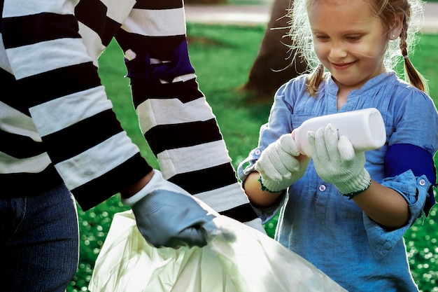 Free photo plastic pollution awareness with girl sorting garbage