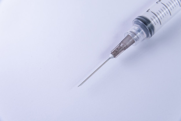 Free Photo plastic syringe on the white background