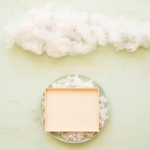 Free photo plate and clouds on table