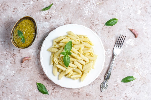 Free photo plate of pasta with homemade pesto sauce.