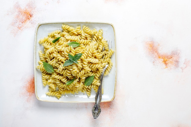 Free Photo plate of pasta with homemade pesto sauce.