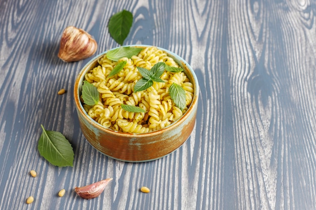 Free photo plate of pasta with homemade pesto sauce.