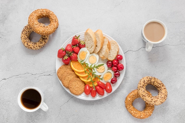 Plate with boiled egg fruits and vegetables