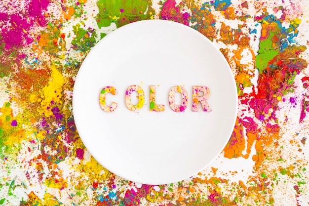 Free photo plate with color inscription on bright dry colours