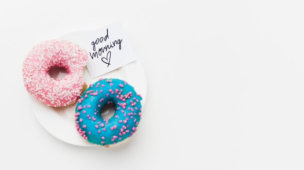 Plate with delicious doughnuts