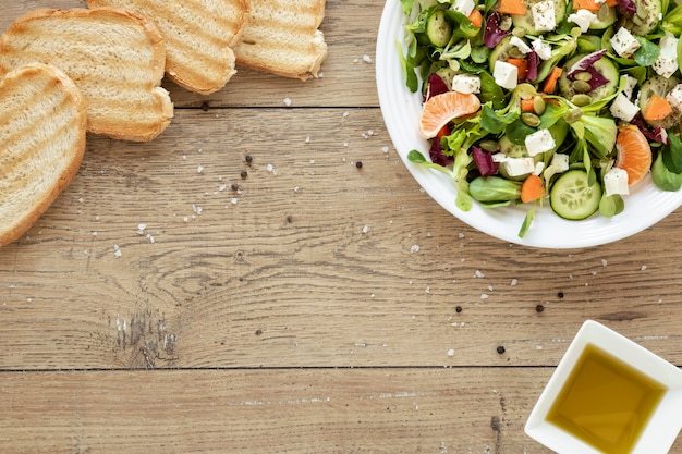 Plate with salad and toast bread