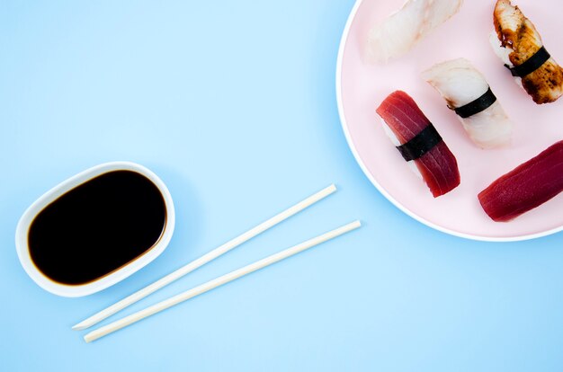 A plate with sushi on a blue background