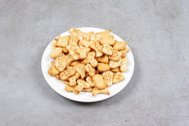 A platter full of crispy crackers on marble background. High quality photo