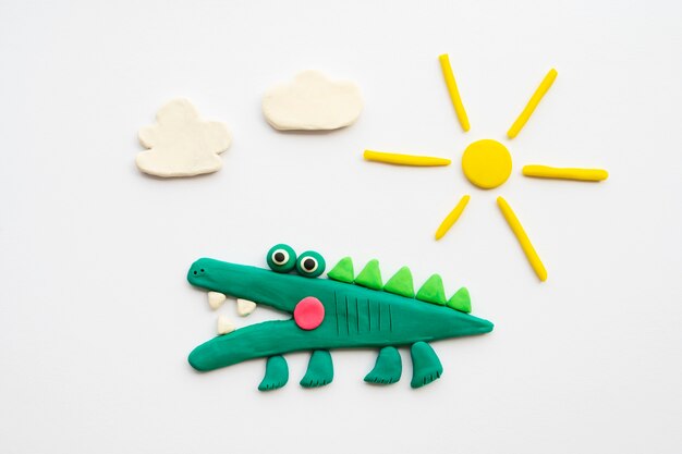 Play dough background with alligator