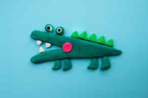 Free photo play dough background with alligator