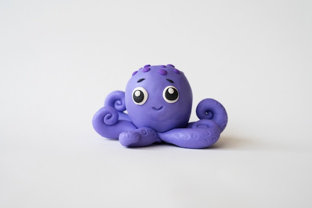 Free Photo play dough background with cute octopus