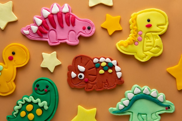 Free photo playdough art with cute dinosaurus above view