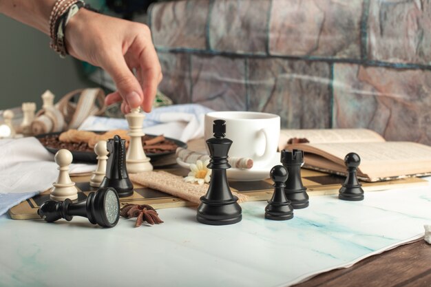 A player playing chess on the table