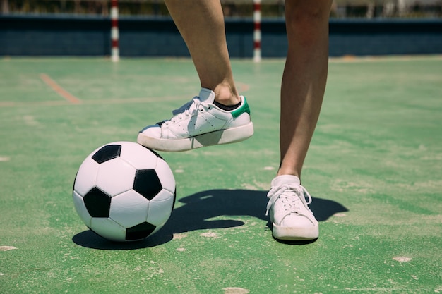 Player with soccer ball with leg in stadium