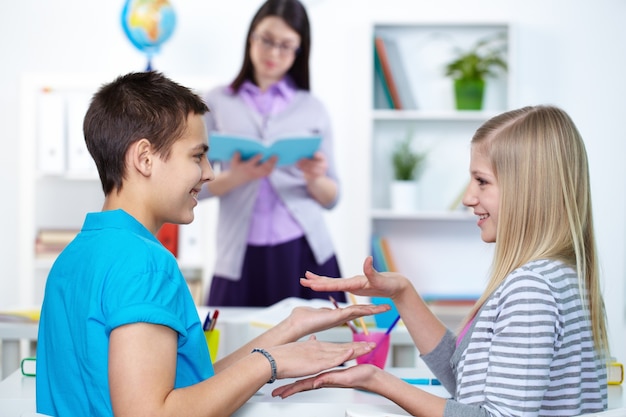 Playful classmates with teacher background