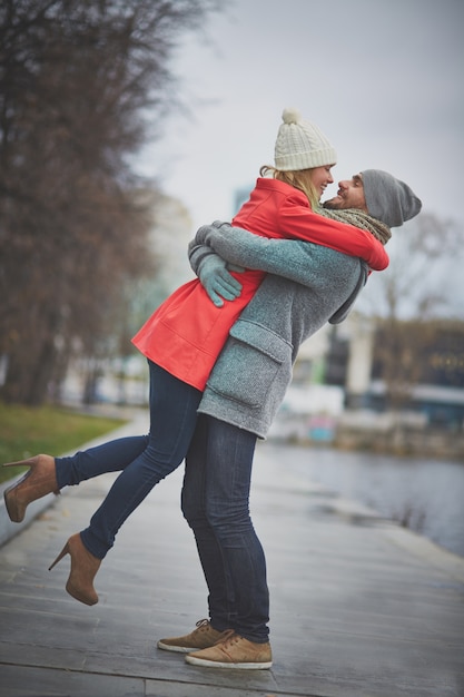 Playful couple hugging