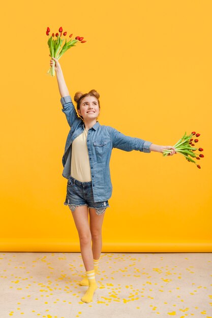 Free photo playful girl with flowers