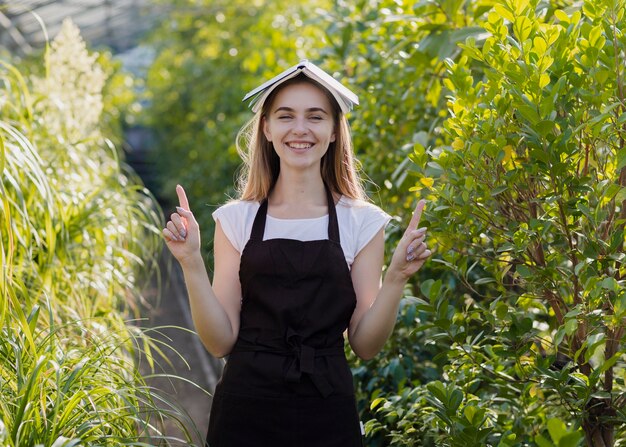 Playful woman with agenda on head