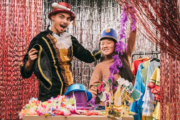 Playful young friends disguised for carnival party