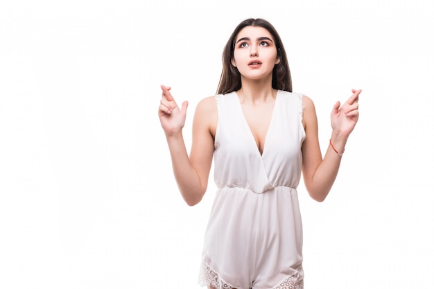 Free photo pleading beautiful young model in modern white dress on white