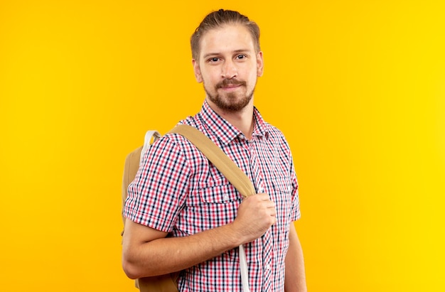 Pleased looking camera young guy student wearing backpack 