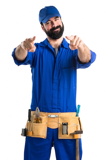 Free photo plumber pointing to the front