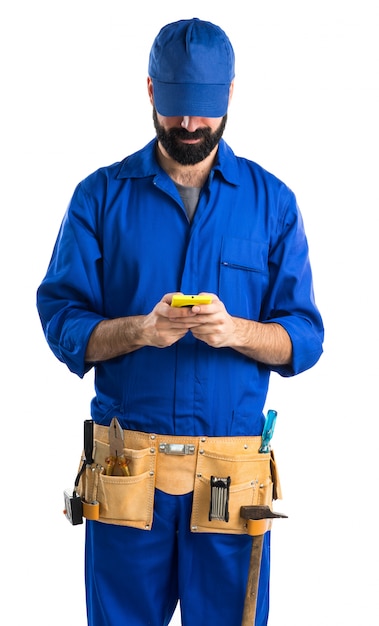 Plumber talking to mobile