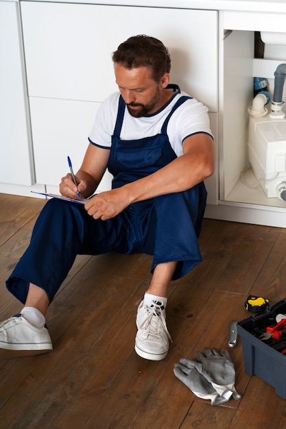 Free photo plumbing professional doing his job