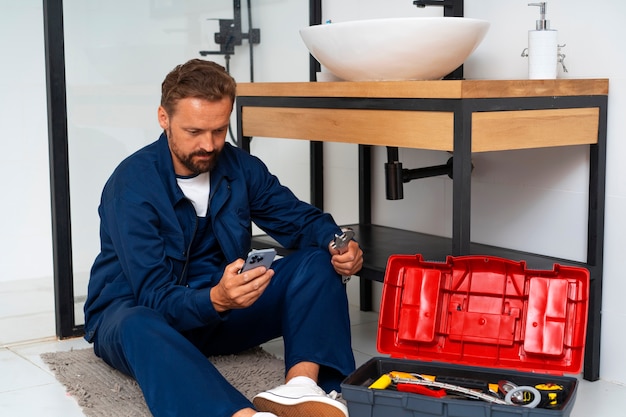 Free Photo plumbing professional doing his job