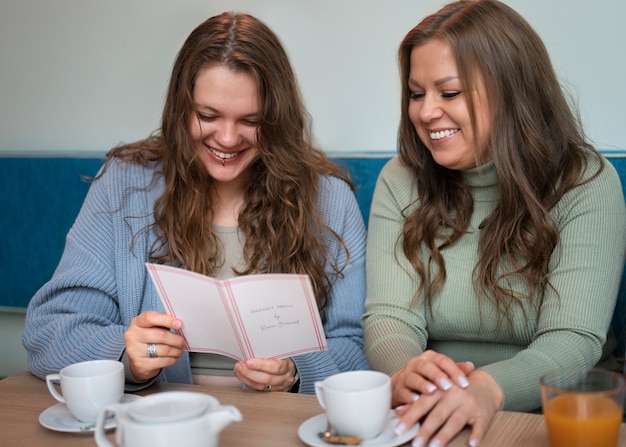 Plus-size female friends spending time together at a restaurant