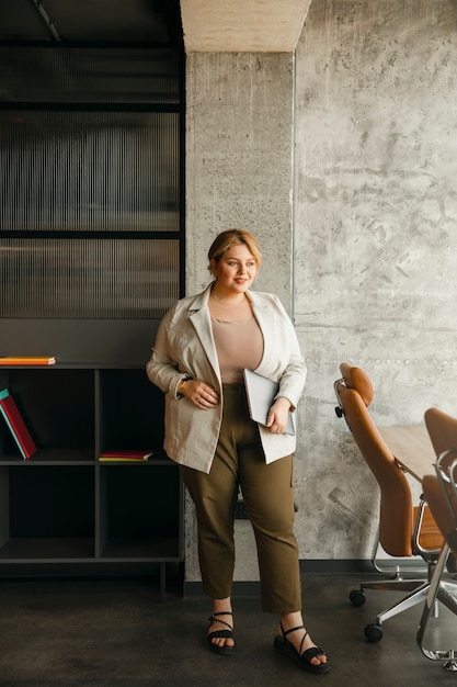 Free Photo plus-size woman working in a professional business office