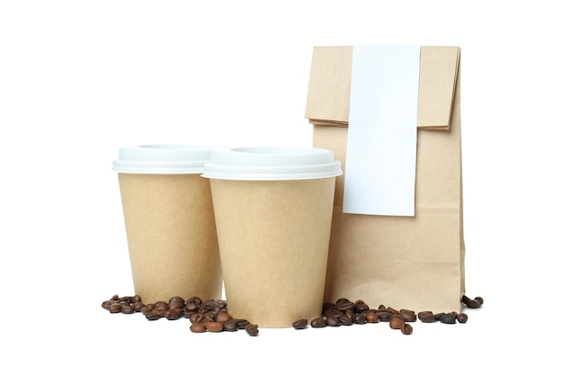 Free photo pngkraft cups for coffee with a paper pack of coffee isolated on white background