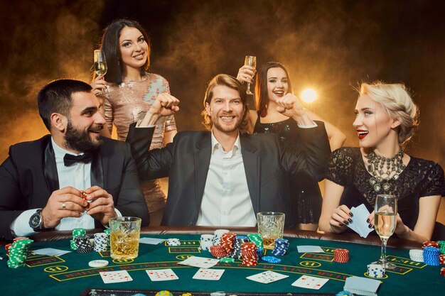 Poker players sitting around a table at a casino. Poker. Gambling. Casino