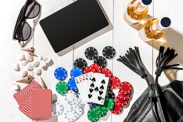 Free Photo poker. set to playing poker with cards and chips on white wooden table, top view. copy space