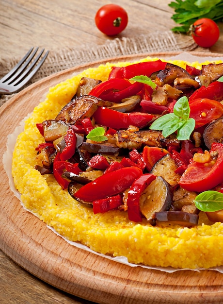 Polenta with vegetables - corn grits pizza with tomato and eggplant