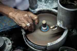 Free photo polishing moonstone at the factory for the extraction and processing of precious stones.