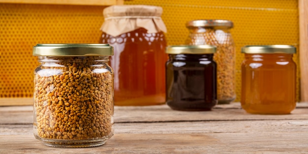 Pollen jar with honey jars and honeycomb