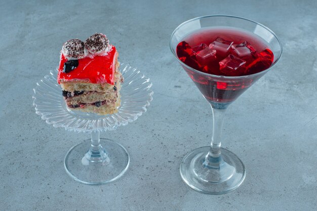 Pomegranate juice with a piece of cake. 