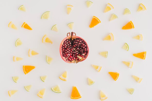 Pomegranate surrounded by different fruits